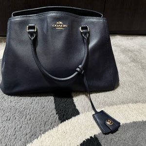 Gently work authentic leather navy Coach women’s bag for sale.
